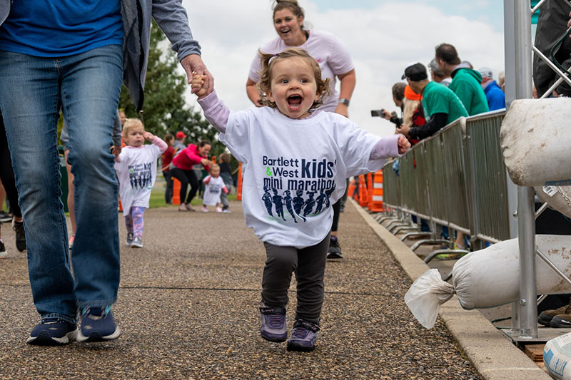child in Bartlett & West Kids' Mini Marathon shirt
