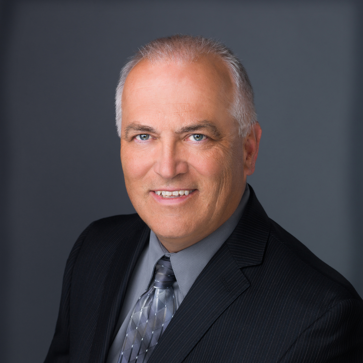 Formal headshot of Brian Hoellein